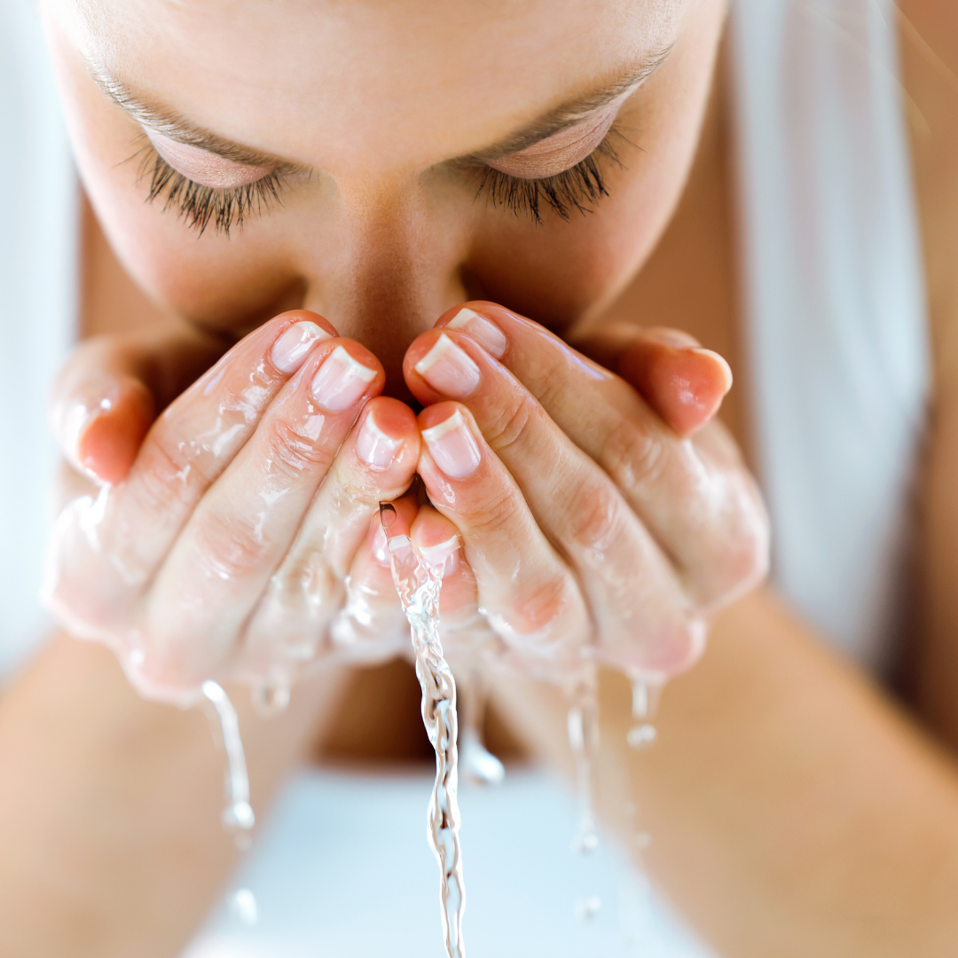 woman washing face